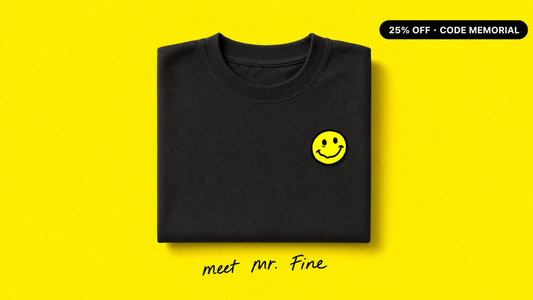 Meet Mr. Fine - crooked smiley patch on black tee, bright yellow background