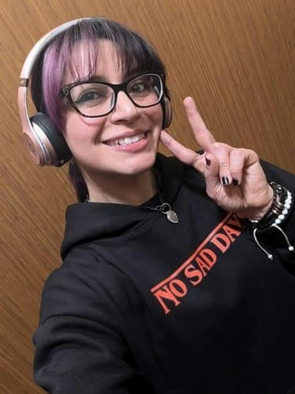 Customer selfie wearing Upside Down hoodie with headphones, front print